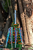 Luang Prabang, Laos. Wat Aham, offer presented to the temple. 